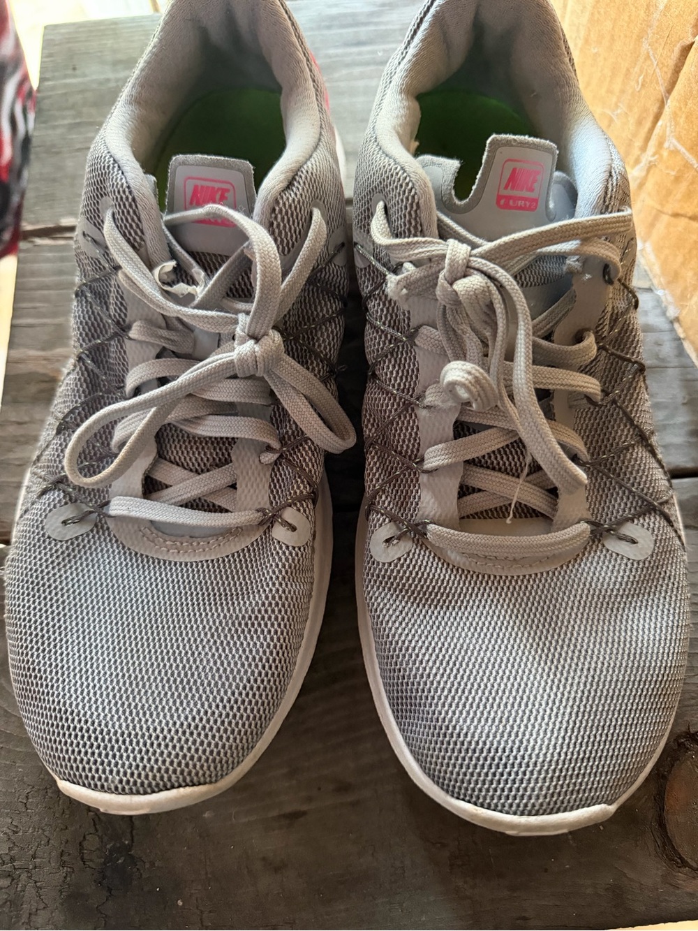 Nike Women’s Light Grey Mesh Athletic Sneakers with Pink Logo Accent